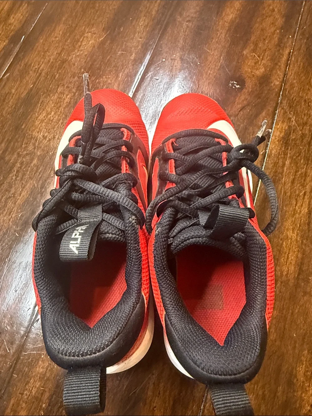 Nike Kids Red and Black Soccer Cleats with White Swoosh